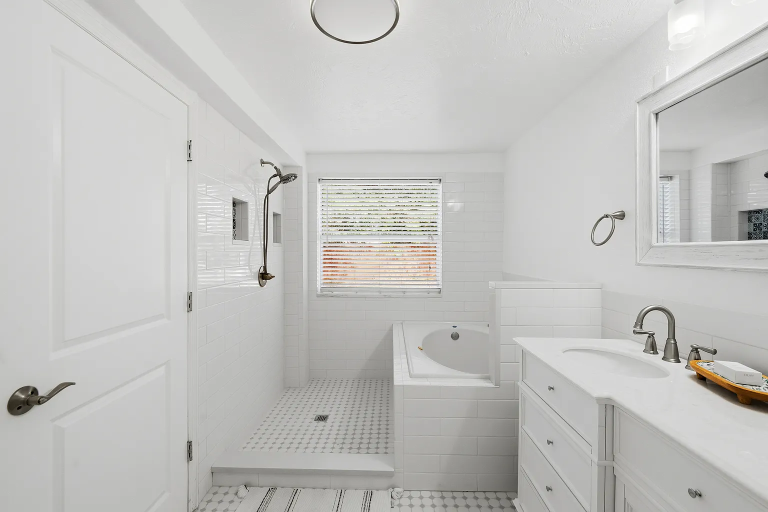 Large updated bathroom with shower and soaking tub