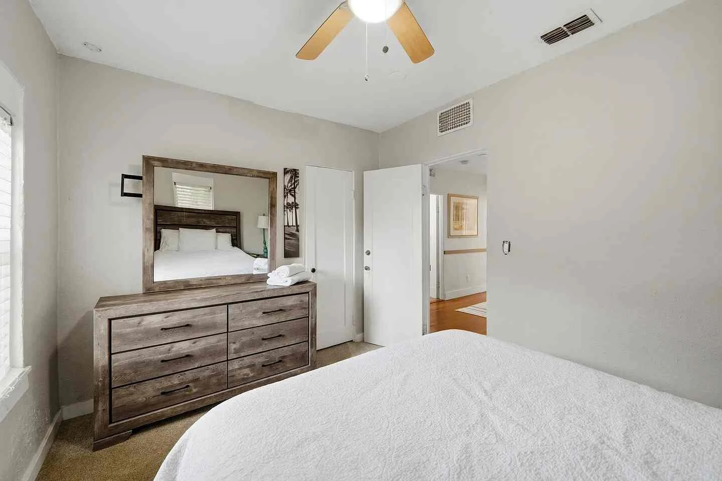 Alternate view of the bright upstairs bedroom and dresser